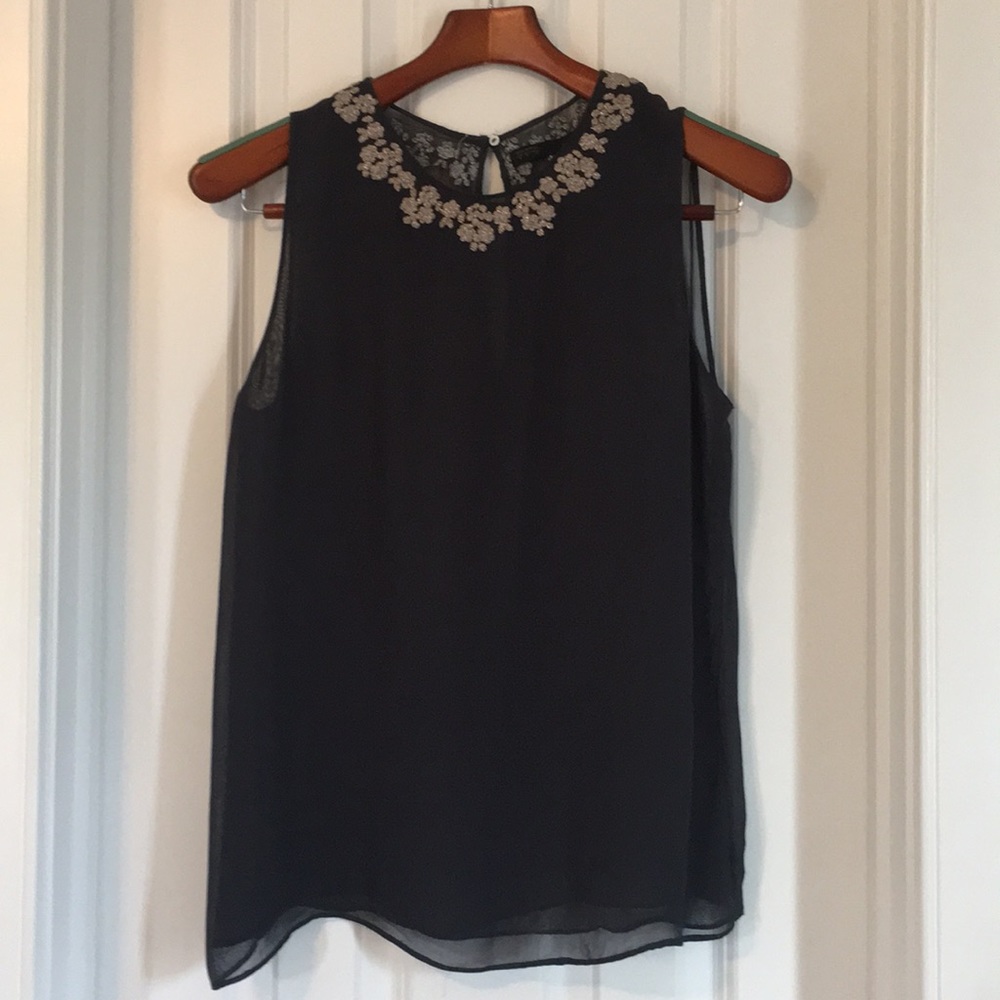 Sheer navy top with silver embroidery.